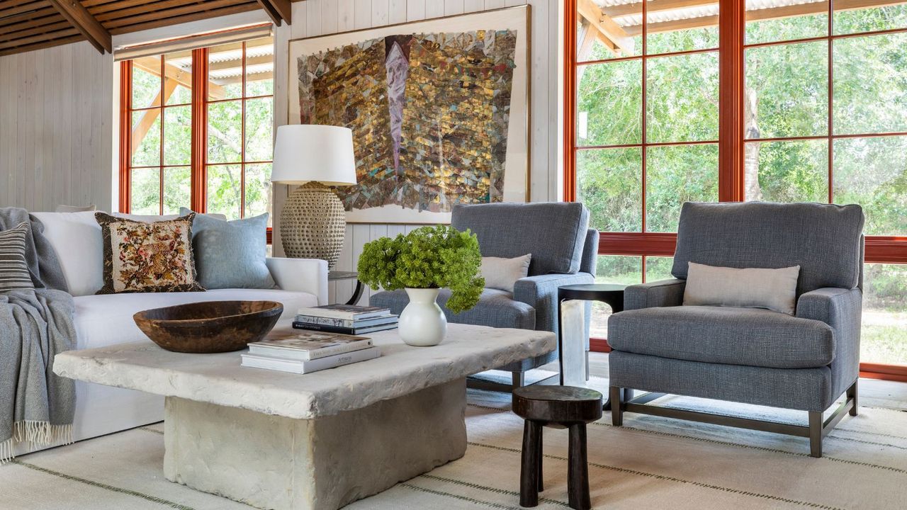 living room with gray sofas and stone coffee table 