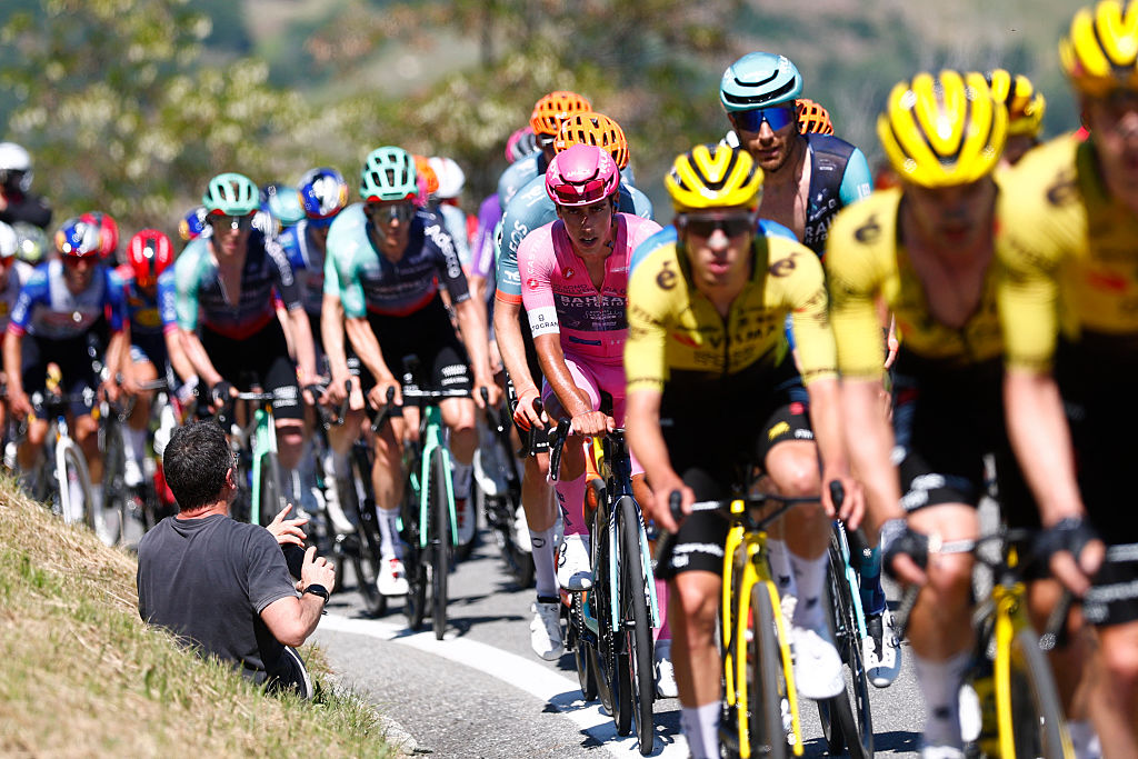 Bahrain - Victorious Portuguese rider Afonso Eulalio rides in the pack during the 14th stage of the Giro d'Italia 2026 - Tour of Italy cycling race between Aosta and Pila (Gressan), Italy, on May 23, 2026. (Photo by Luca Bettini / AFP)
