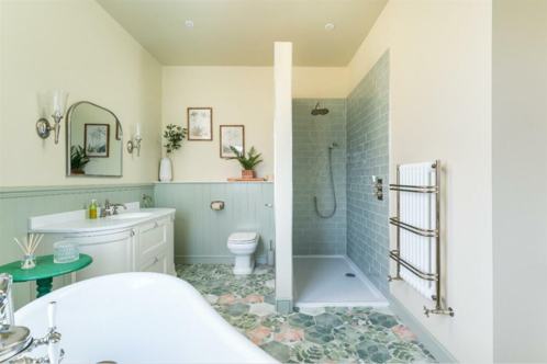 A lime green bathroom with tiled floors