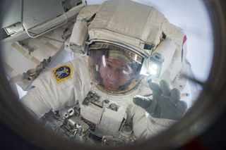 Expedition 50 Cmdr. Shane Kimbrough of NASA is seen floating into the Quest airlock at the conclusion of a spacewalk on March 24, 2017.