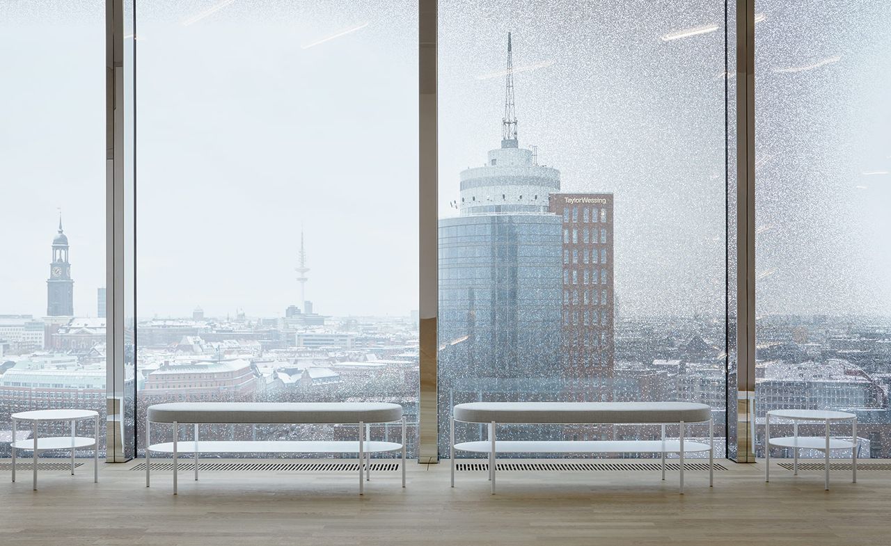 glass wall and white tables