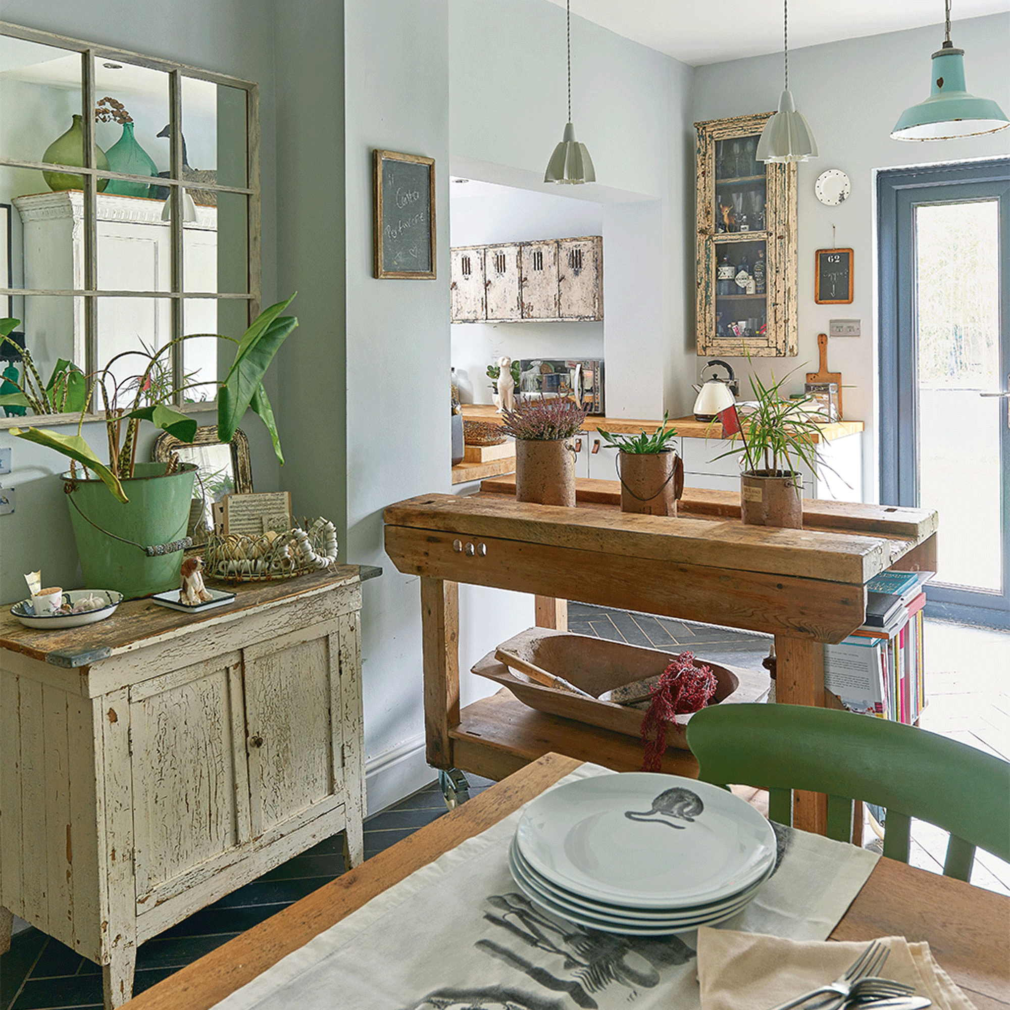 Green kitchen with wooden island