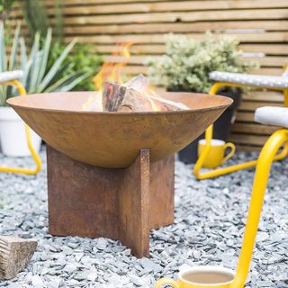 la hacienda fire pit on a shingle gravel patio area