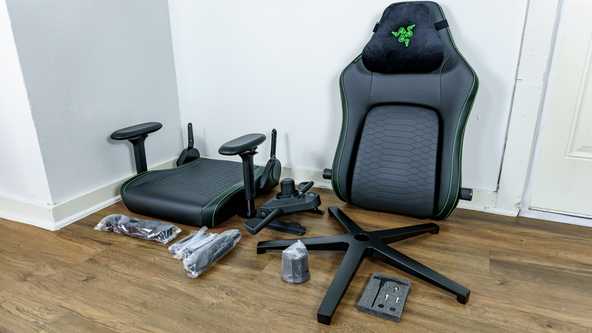 The Razer Iskur V2 NewGen unboxed with all of the parts laid out on the floor