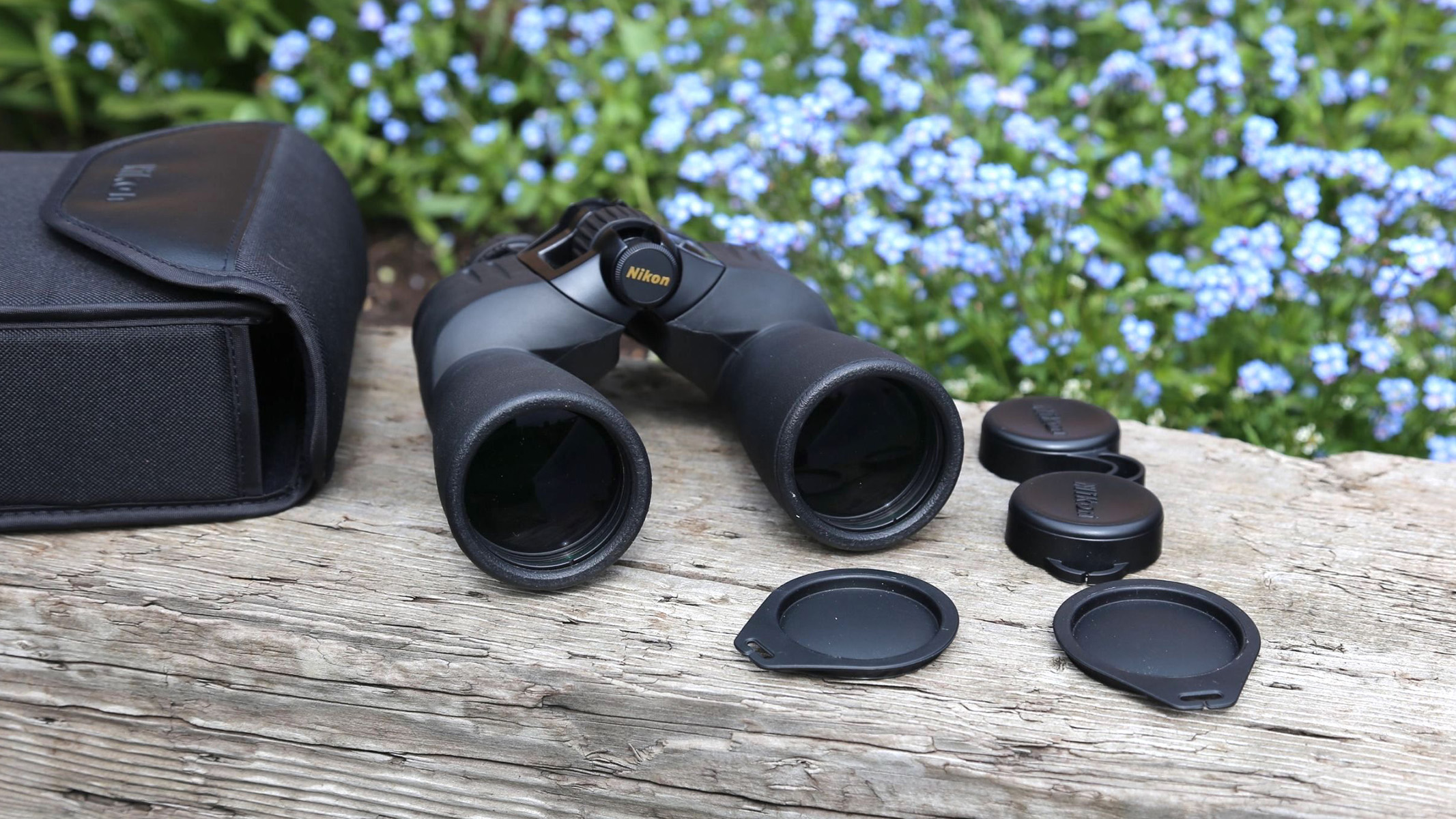 Image shows everything that is included with the Nikon Action EX 12x 50 binoculars