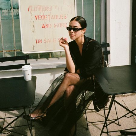 Woman outside with coffee