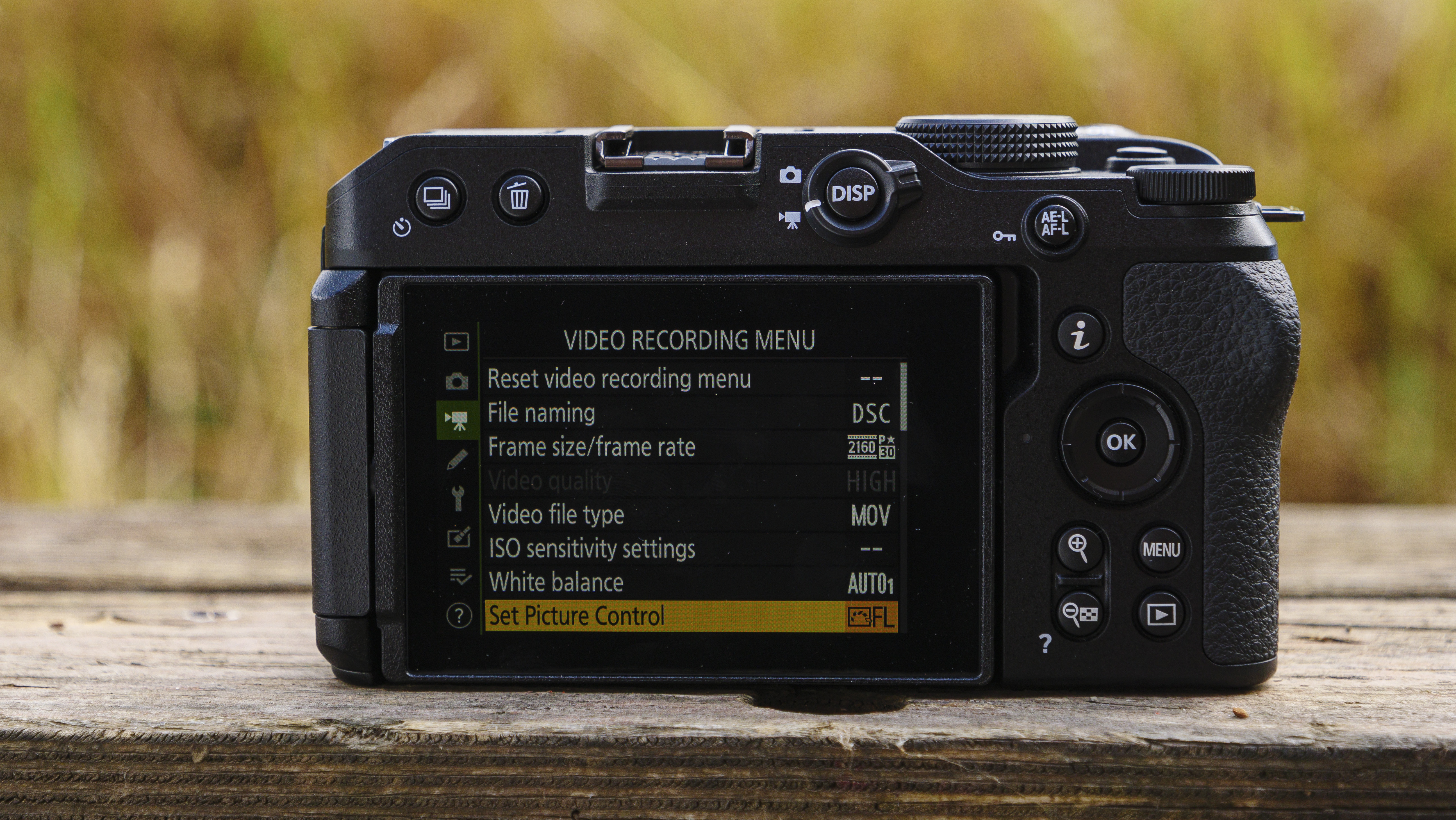 Rear of the Nikon Z30 with docked touchscreen showing menu screens