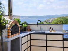 outdoor sink ideas; outdoor kitchen with outdoor sink by Lundhs
