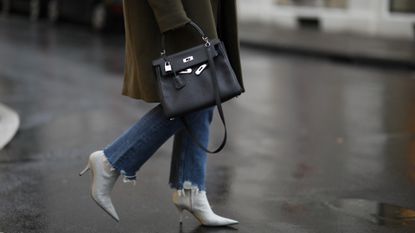 how to wear boots with jeans street style Lou Beyer wearing Balenciaga heels, Hermès bag, Agolde jeans, Zara blazer 