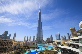 The Burj Khalifa stands tall over Dubai on a sunny day