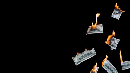 Burning hundred-dollar bills, symbolizing inflation