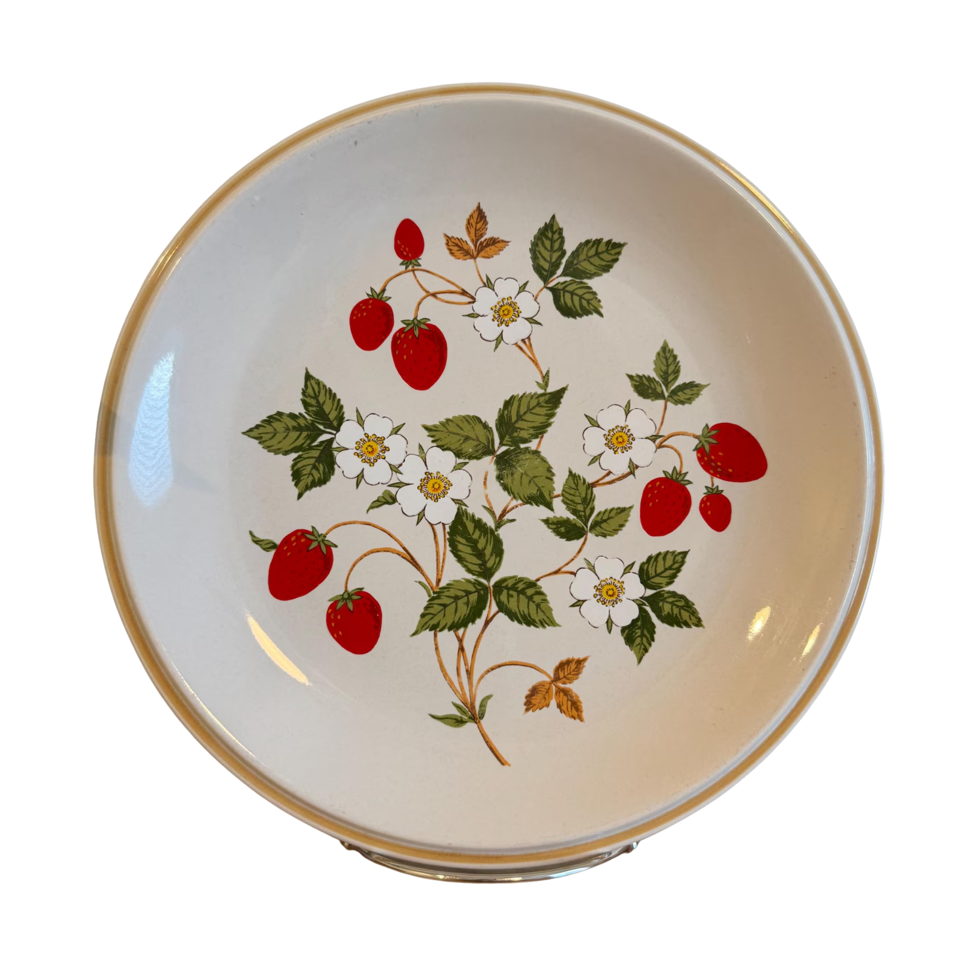 a vintage plate with strawberries and white flowers