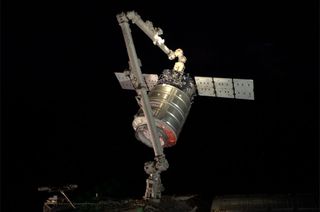 European Space Agency astronaut Alexander Gerst snapped this photo of an Orbital Sciences Corporation Cygnus spacecraft at the end of a robotic arm after the cargo ship arrived at the International Space Station on July 16, 2014.