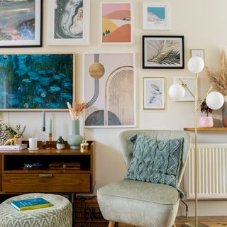 A living room with a gallery wall and a Frame TV with a single cable running down