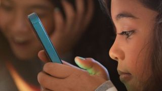Google Family link on phone in girl's hand