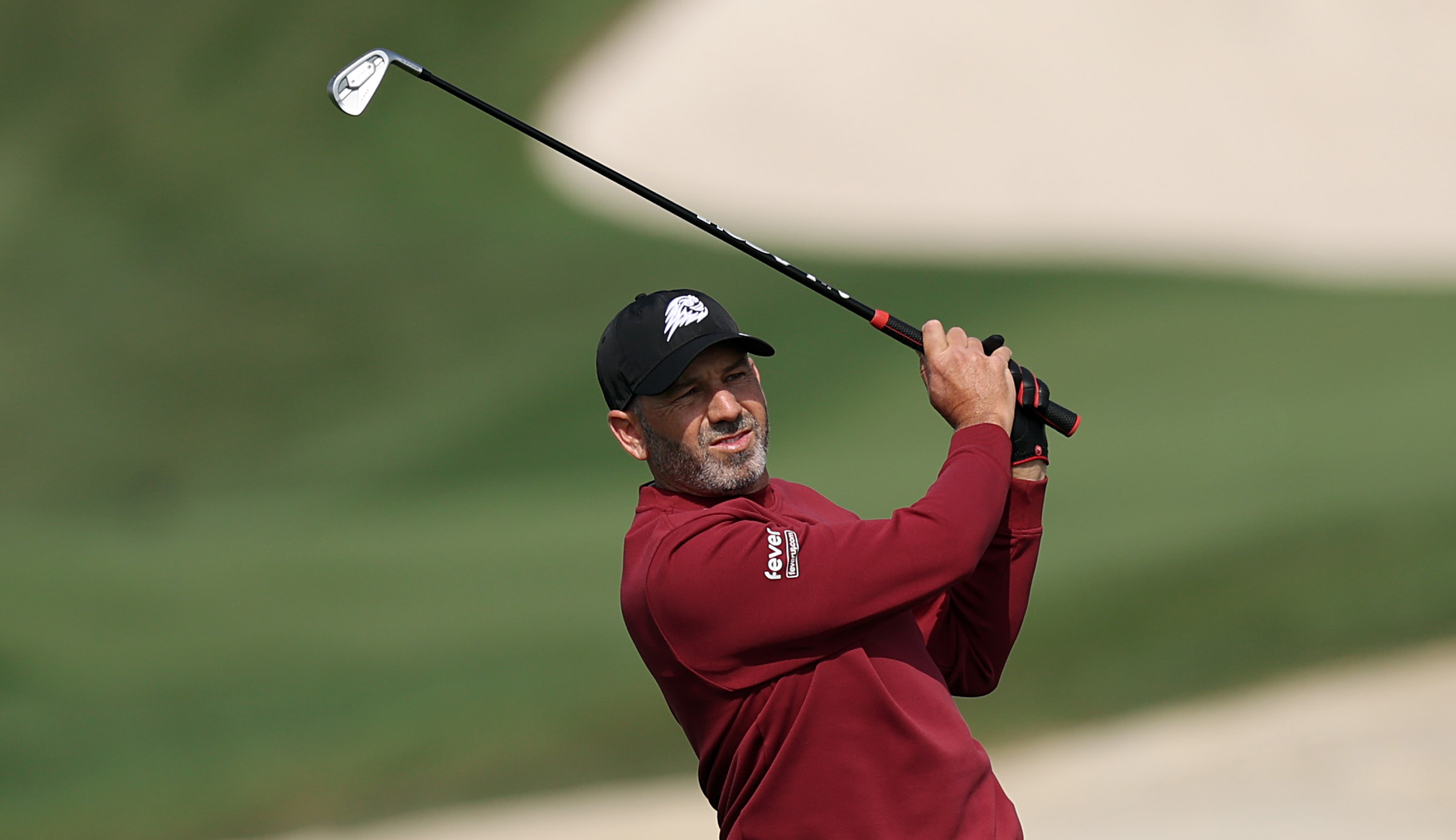 Sergio Garcia hits an iron shot into the green