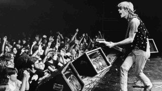 Tom Petty performing onstage in 1980