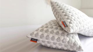 Two Layla Kapok Pillows on a white mattress