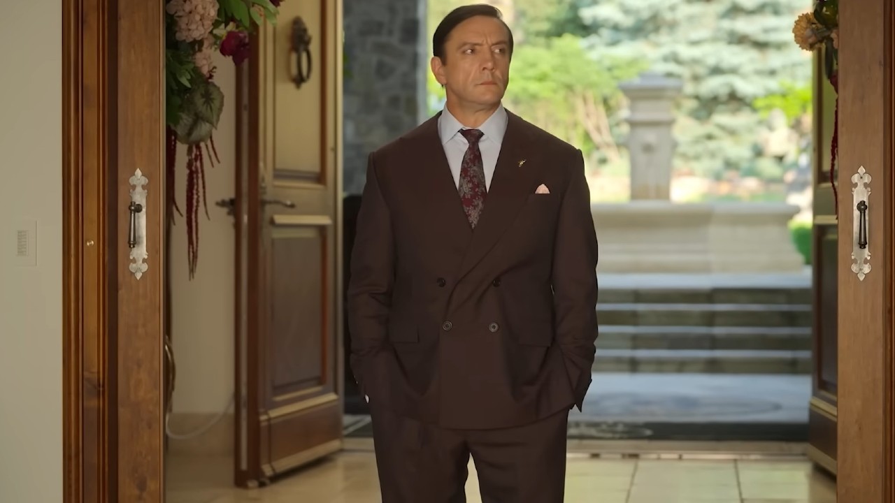 Peter Serafinowicz standing at the door in Million Dollar Secret.