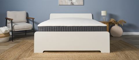 The Emma Elite Mattress on a bed frame in a bedroom