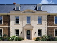 Fig 2: The entrance, with segmental pediments. Woodford Hill Farm, Northamptonshire. ©Will Pryce for Country Life