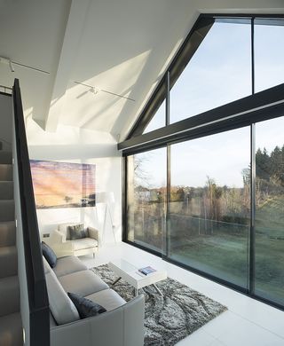 contemporary living room with full height slimline glazed gable