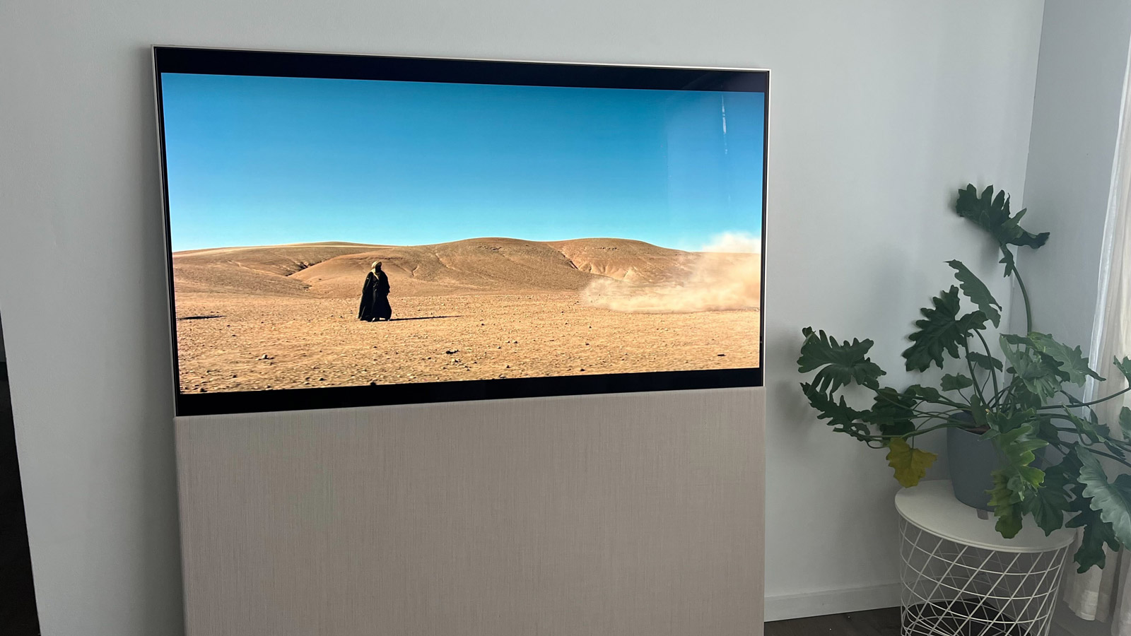 LG Easel OLED TV with a movie scene on screen