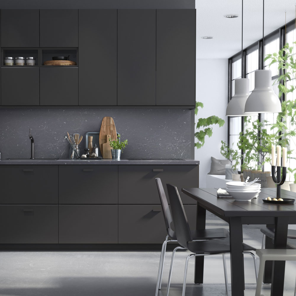 kitchen with black cabinets and dinning table and chair