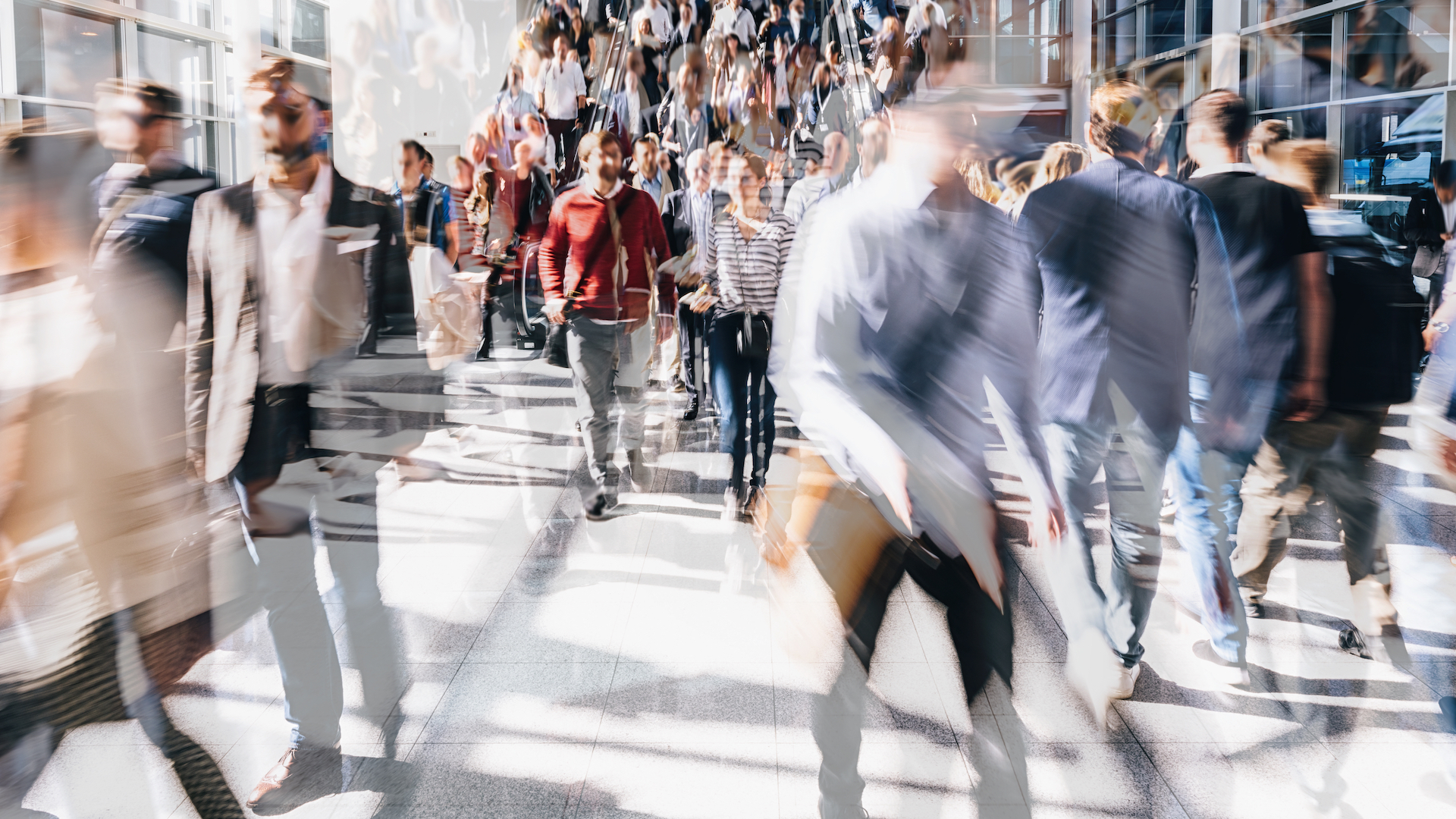 A layered photo of a crowd of people walking on a street in London