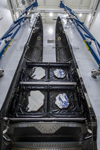 SES' two 03b mPower satellites are seen stacked atop SpaceX's Falcon 9 rocket for launch.