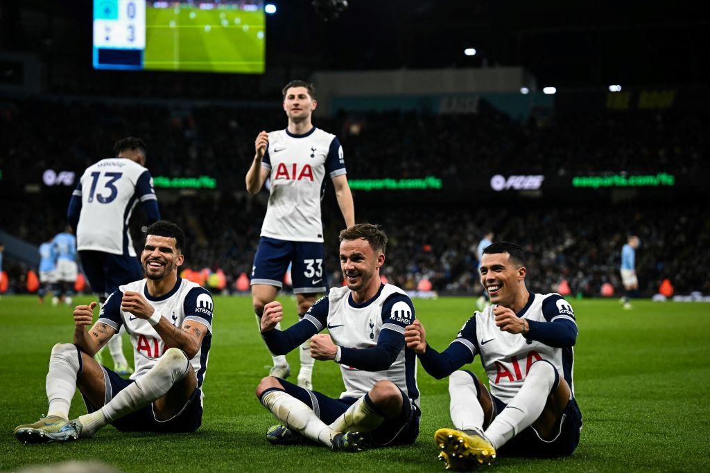 TOPSHOT - Tottenham Hotspur&#039;s Spanish defender #23 Pedro Porro (R) celebrates with Tottenham Hotspur&#039;s English midfielder #10 James Maddison and teammates after scoring his team third goal during the English Premier League football match between Manchester City and Tottenham Hotspur at the Etihad Stadium in Manchester, north west England, on November 23, 2024. (Photo by Paul ELLIS / AFP) / RESTRICTED TO EDITORIAL USE. No use with unauthorized audio, video, data, fixture lists, club/league logos or &#039;live&#039; services. Online in-match use limited to 120 images. An additional 40 images may be used in extra time. No video emulation. Social media in-match use limited to 120 images. An additional 40 images may be used in extra time. No use in betting publications, games or single club/league/player publications. / (Photo by PAUL ELLIS/AFP via Getty Images)