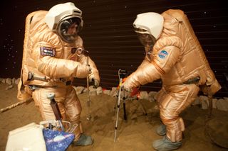 The crew trains for a "Marswalk" at the simulated Martian terrain of the Mars500 experiment.