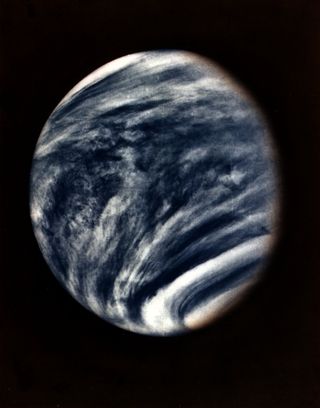 This picture of Venus was captured by the Mariner 10 spacecraft during its approach to the planet in early 1974. Taken with the spacecraft's imaging system using an ultraviolet filter, the picture has been color enhanced to simulate Venus's natural color as the human eye would see it.