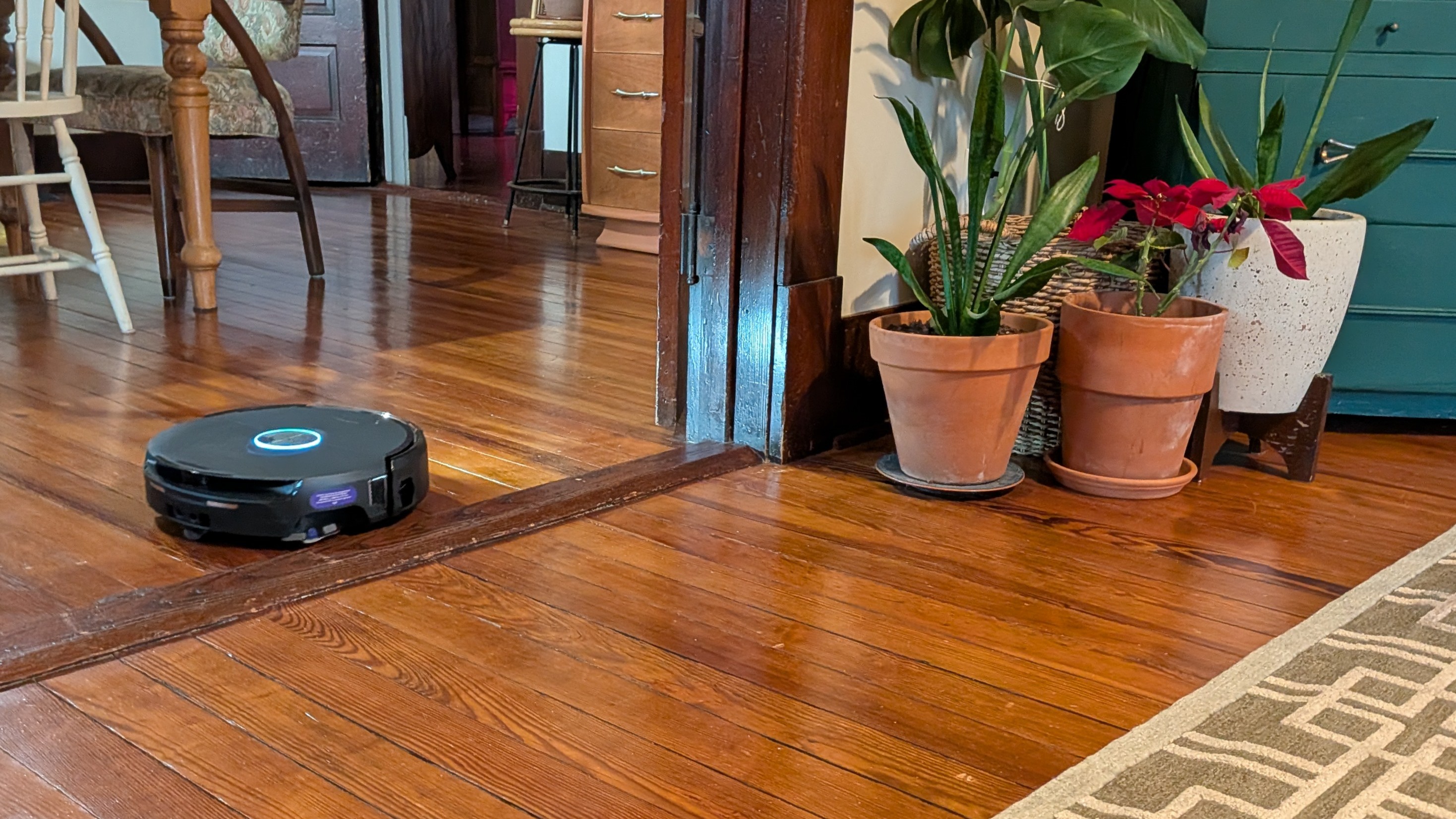 Narwal Flow 2 robot vacuum beside door lintel