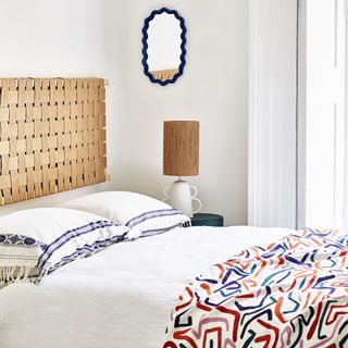 White bedroom with woven headboard