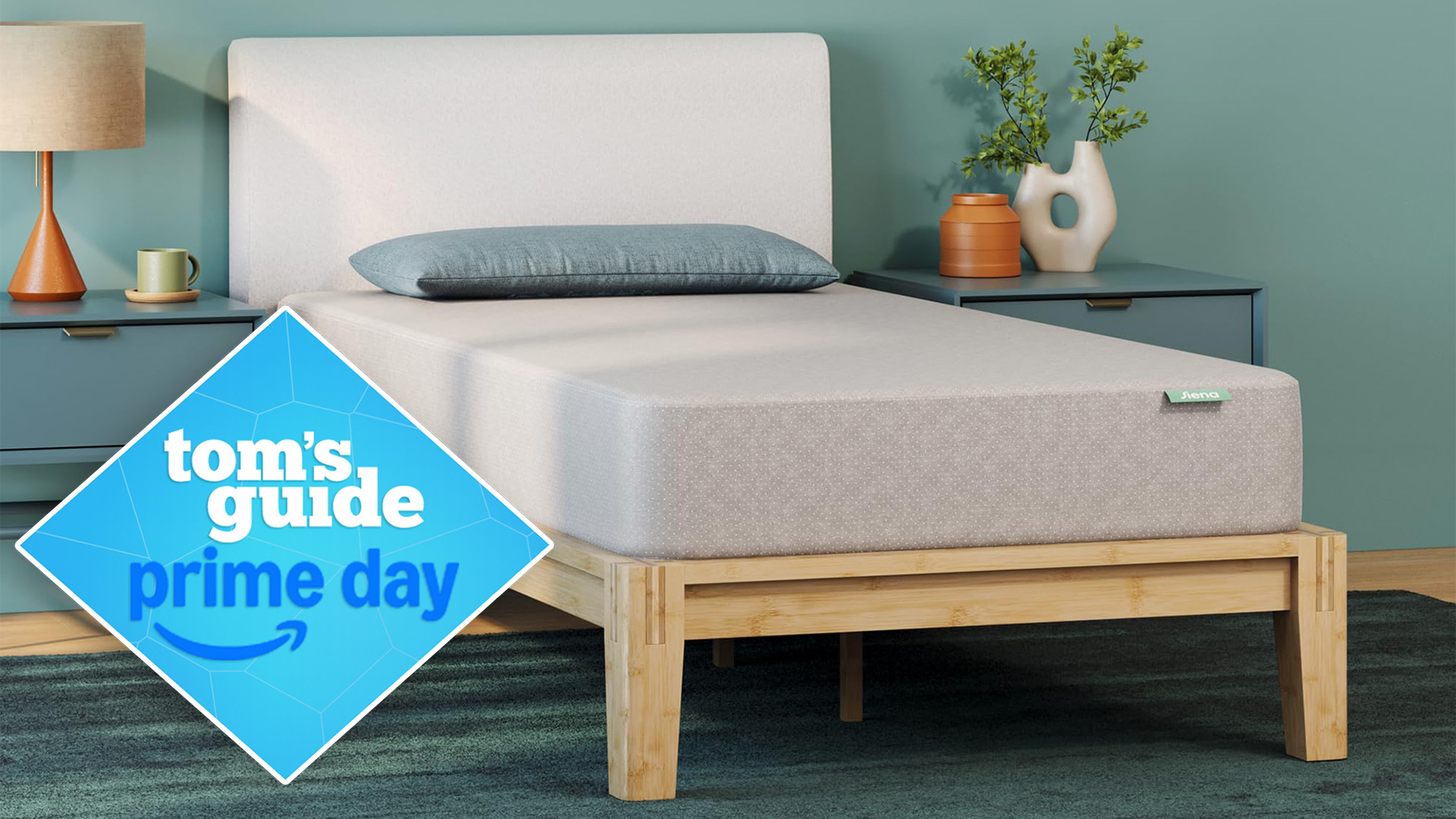 A twin Siena Essential Memory Foam Mattress on a bed frame in a bedroom, a Tom&#039;s Guide Prime Day deals graphic in the bottom left corner