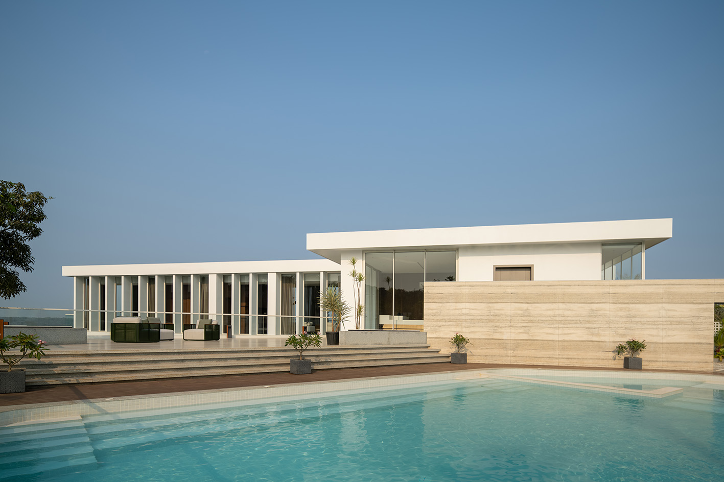 a white Goa villa in the leafy indian forest