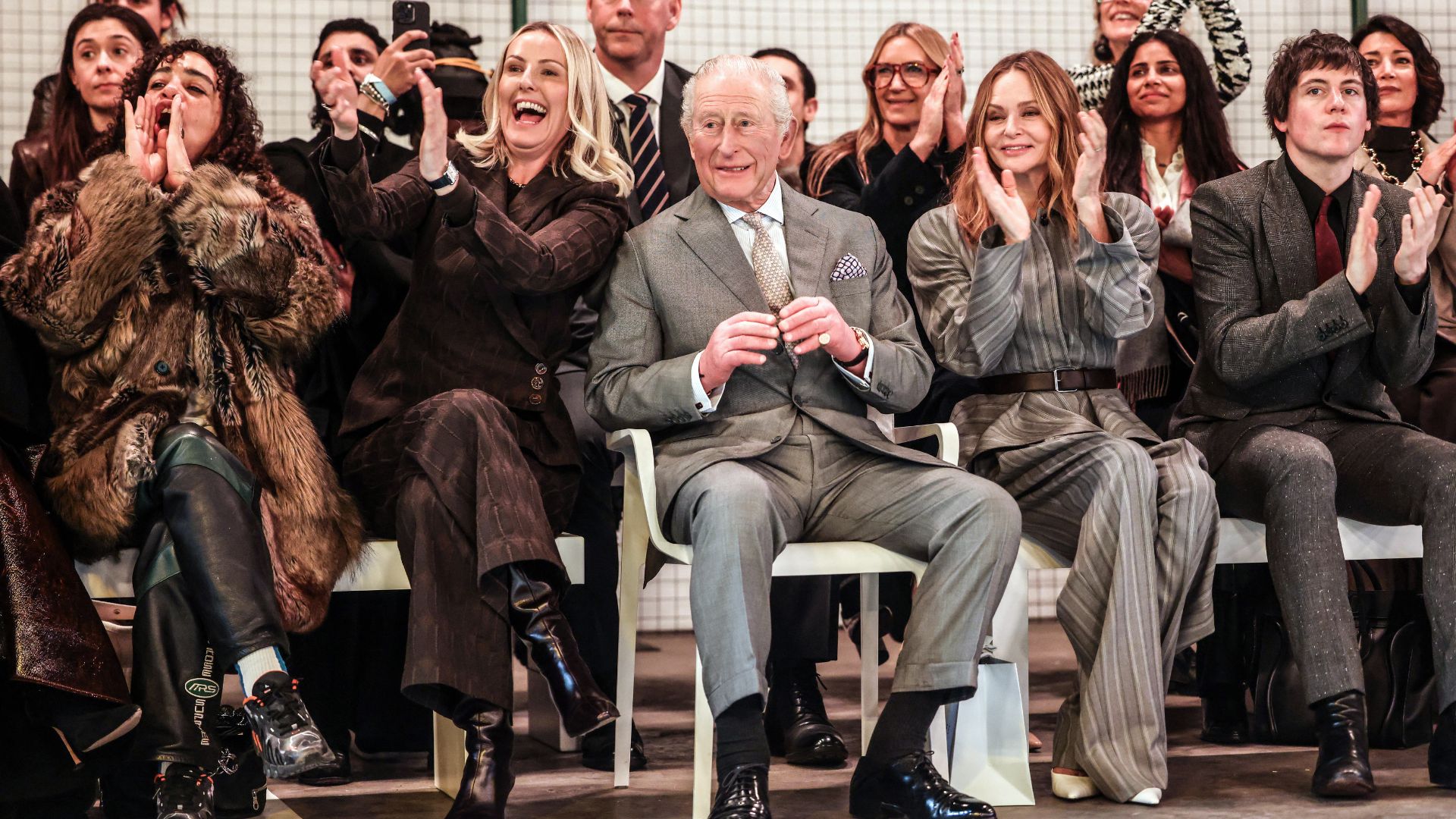 King Charles sitting with Laura Weir (L) and British fashion designer Stella McCartney (R) during the opening show of London Fashion Week 2026