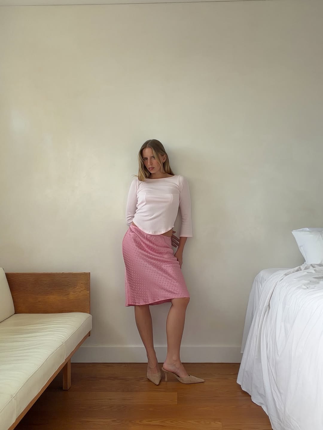 Woman wearing boatneck top.