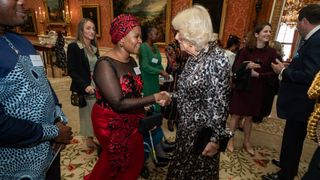 Queen Camilla with Dr Anne Makena during a reception