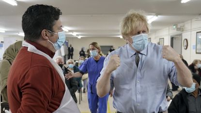 Boris Johnson visits a COVID-19 vaccination centre in Batley