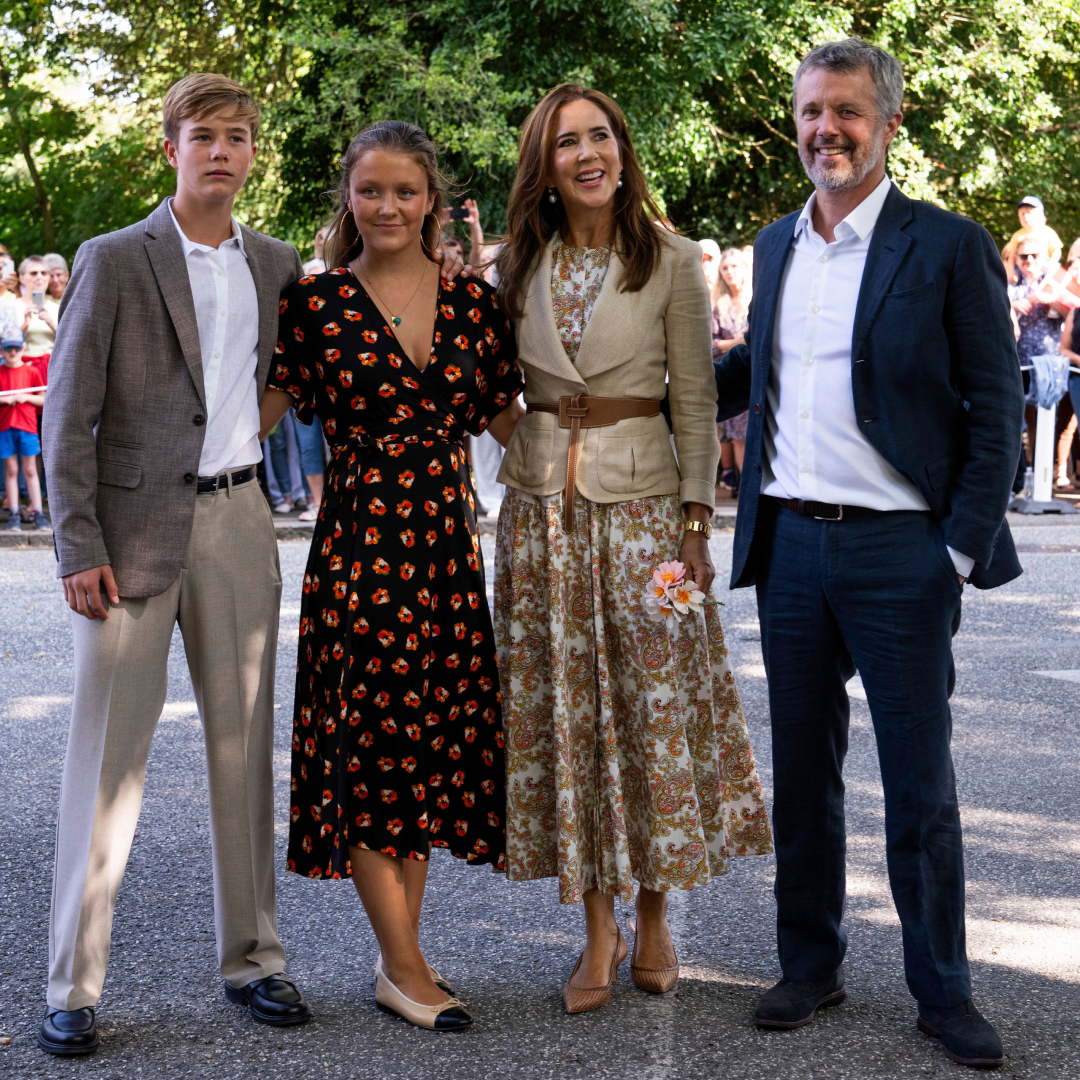 Crown Prince Christian, Princess Isabella, Queen Mary and King Frederik posing with their arms around each other