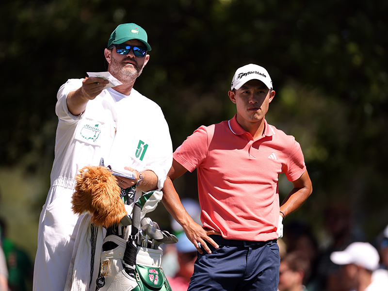 Collin Morikawa with his caddie at The Masters