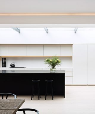 White kitchen ideas with black island unit