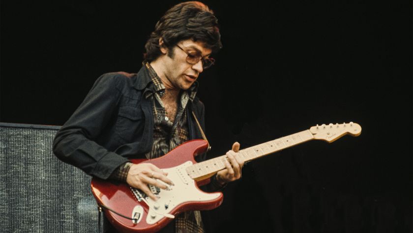Canadian singer-songwriter and guitarist Robbie Robertson performing with The Band at Wembley, London, 14th September 1974. 