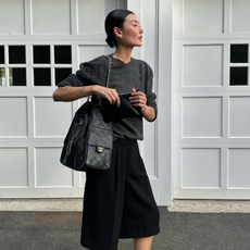 Amalie in a black and grey tonal outfit