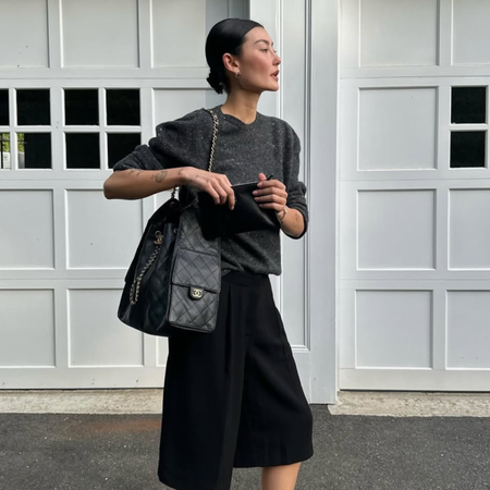 Amalie in a black and grey tonal outfit