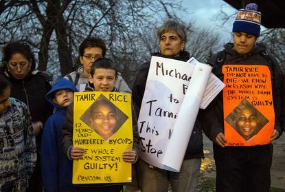 Signs displayed in a rally protesting Tamir Rice's death