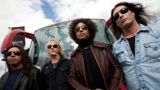 Alice Chains pose in front of their tour bus, 2009