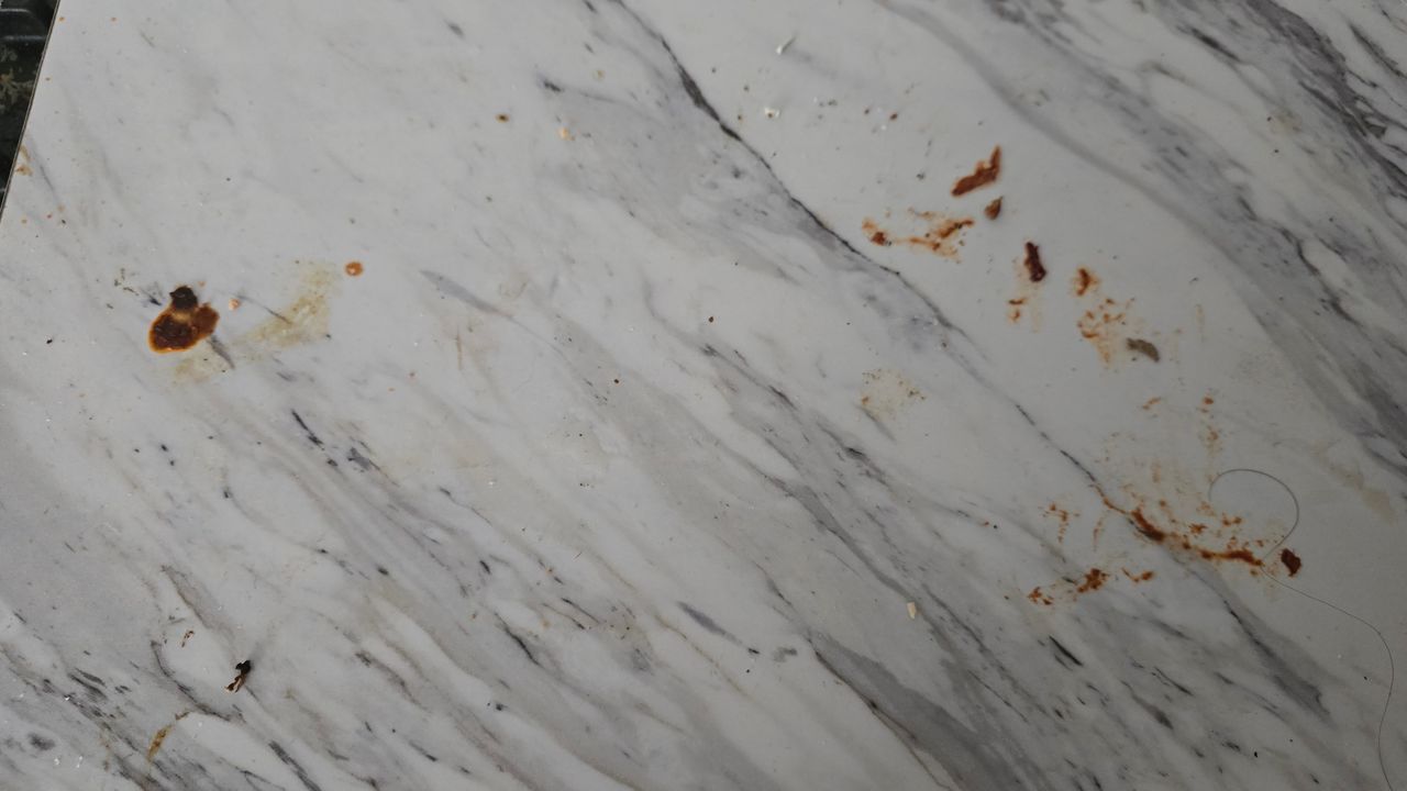 Marble look laminate worktop with stains